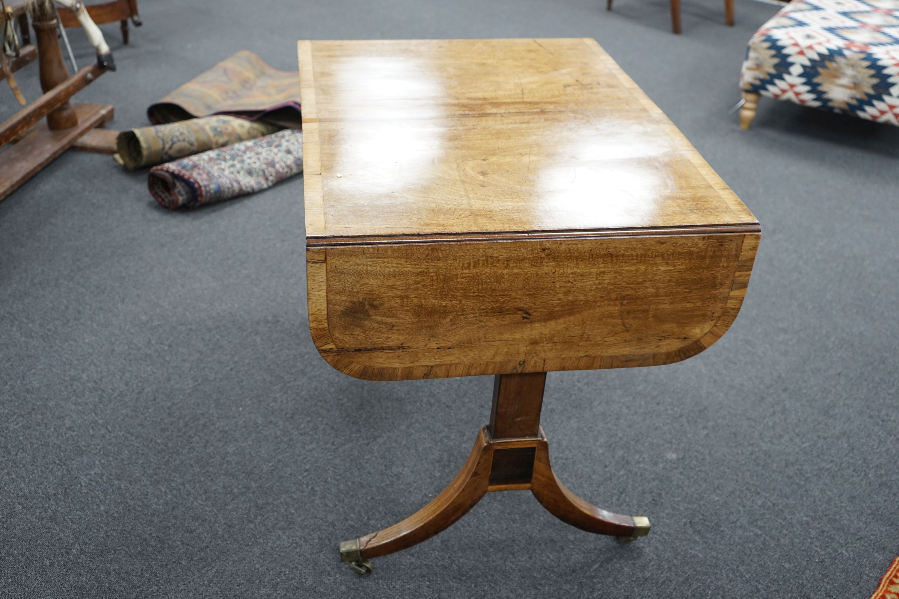 A Regency rosewood banded mahogany sofa table, width 91cm, depth 65cm, height 70cm